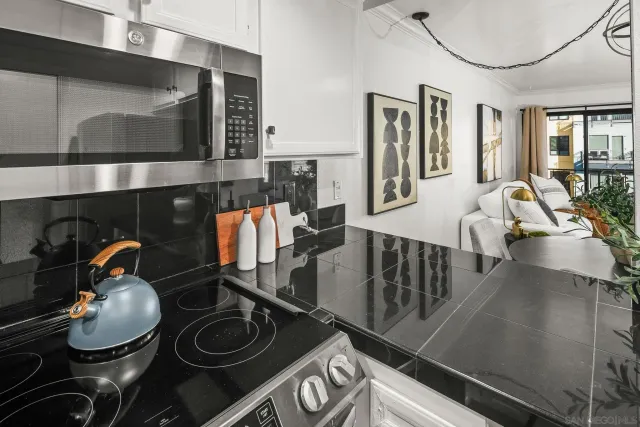 a kitchen with furniture and a stove