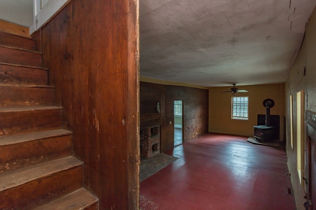 11 Ed Clark Road Hubbardston, MA 01452 - Photo 26 of 42 a view of a hallway with wooden floor and a living room