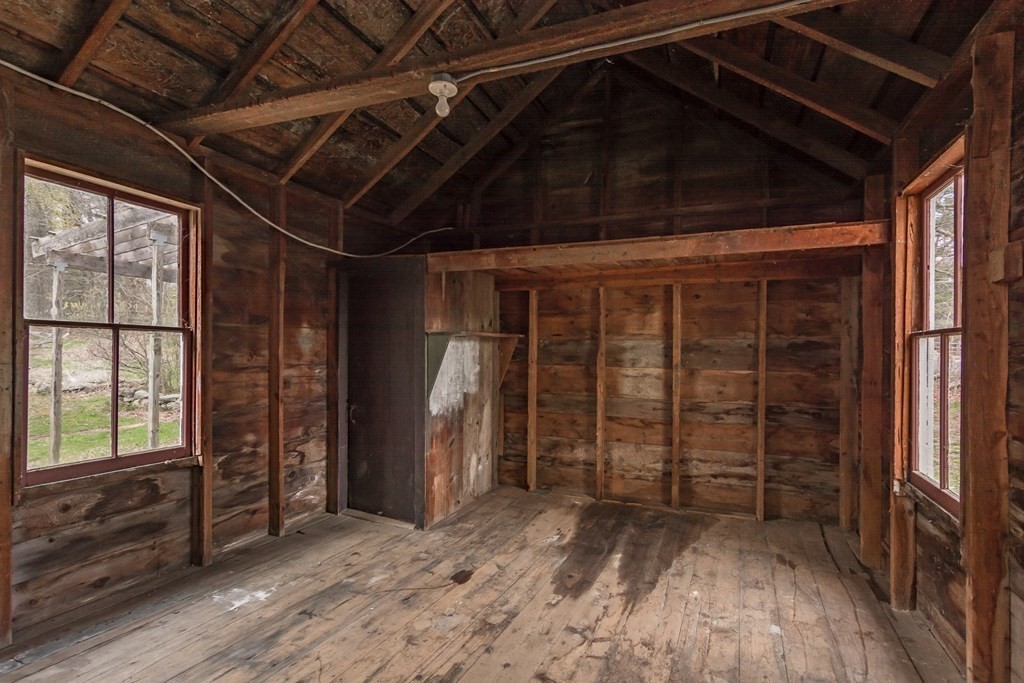 11 Ed Clark Road Hubbardston, MA 01452 - Photo 39 of 42 a view of empty room with wooden floor and windows
