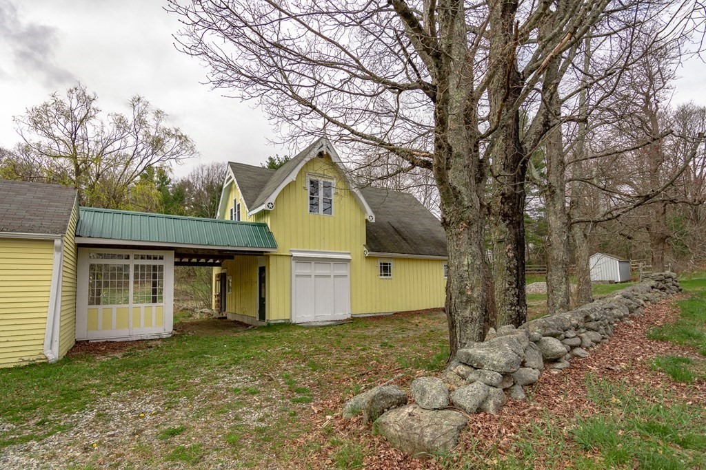 11 Ed Clark Road Hubbardston, MA 01452 - Photo 6 of 42 a front view of house with a garden