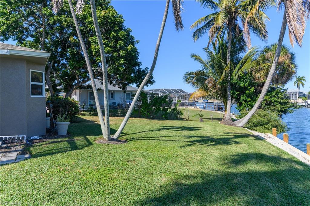 875 Robin Court Marco Island, FL 34145 - Photo 11 of 30 a view of a palm tree with a park