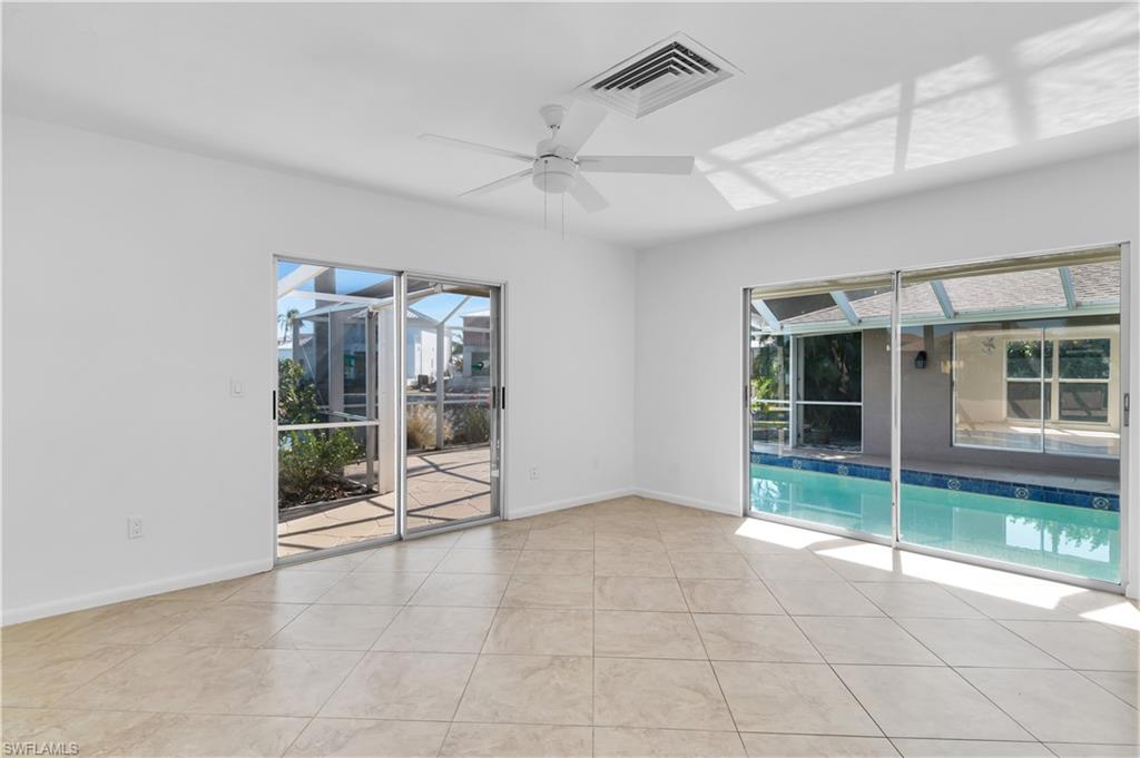 875 Robin Court Marco Island, FL 34145 - Photo 20 of 30 a view of an empty room with windows