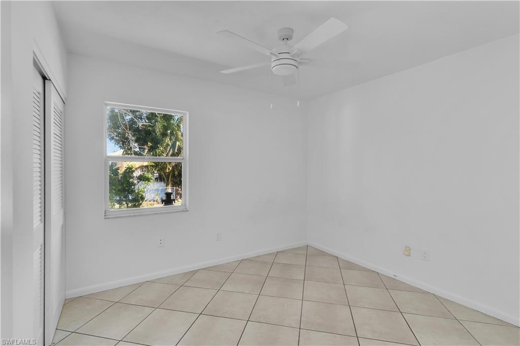 875 Robin Court Marco Island, FL 34145 - Photo 24 of 30 an empty room with windows