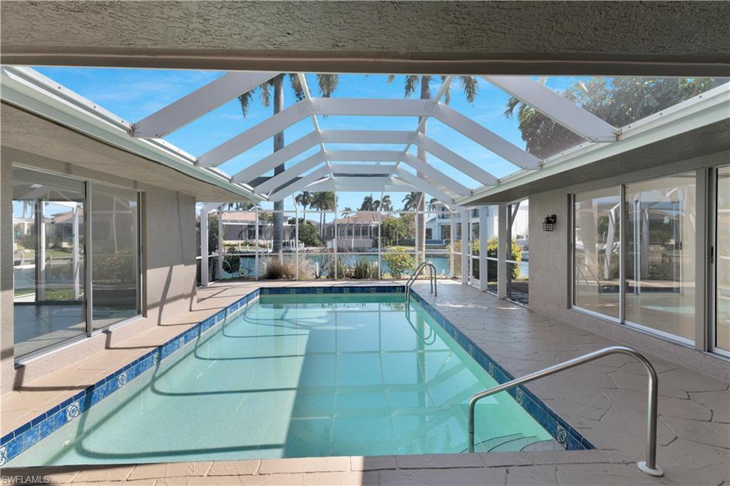 875 Robin Court Marco Island, FL 34145 - Photo 7 of 30 a view of a swimming pool