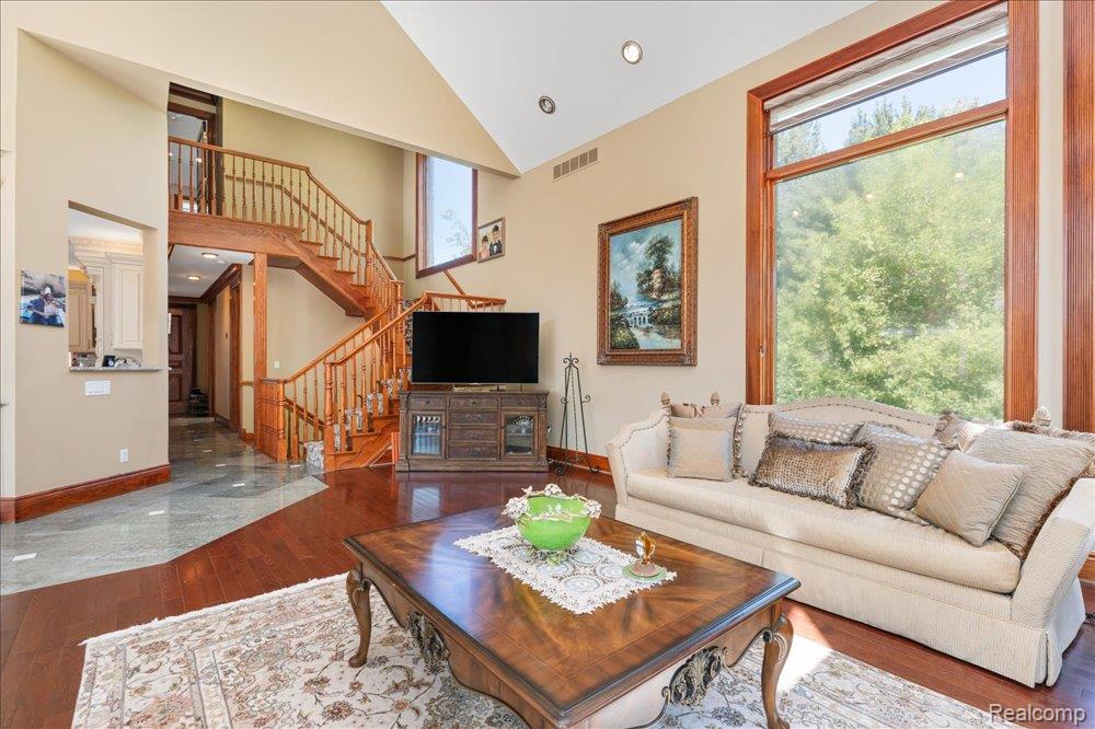 3543 Cedar Brook Drive Rochester, MI 48309 - Photo 26 of 99 Vaulted ceiling, wood-finish flooring, and large picture windows