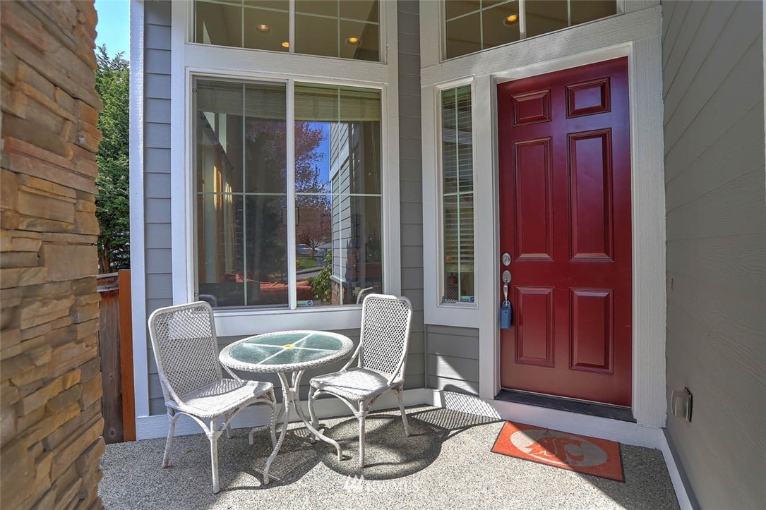 363 Pasco Drive Northeast Renton, WA 98059 - Photo 2 of 26 a patio with a table and chairs