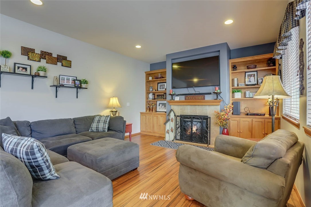 363 Pasco Drive Northeast Renton, WA 98059 - Photo 11 of 26 a living room with furniture and a fireplace