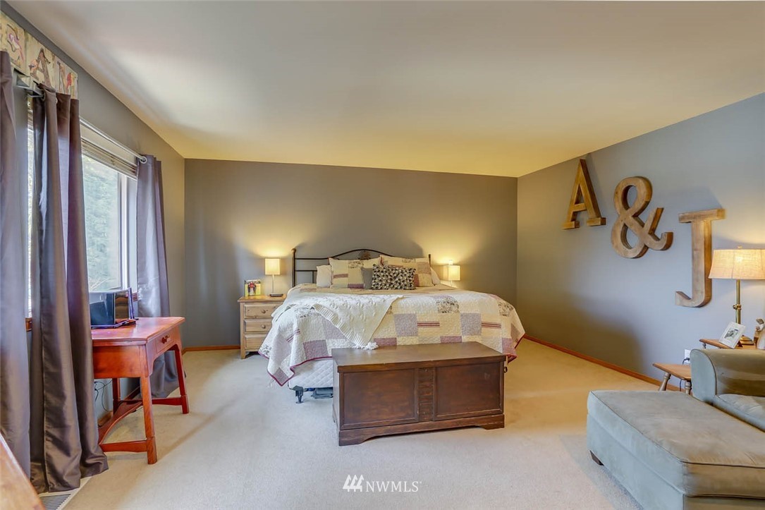 363 Pasco Drive Northeast Renton, WA 98059 - Photo 14 of 26 a bedroom with a bed and a couch