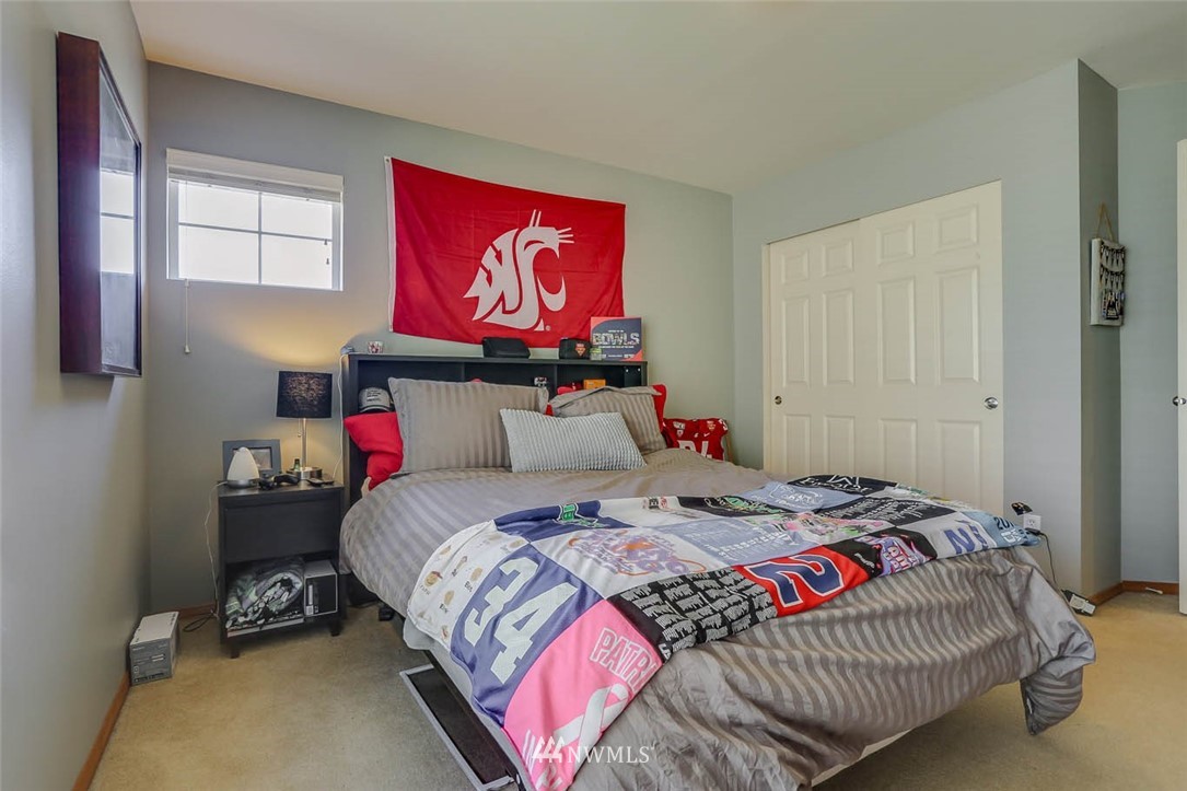 363 Pasco Drive Northeast Renton, WA 98059 - Photo 19 of 26 a bedroom with a bed and wooden floor