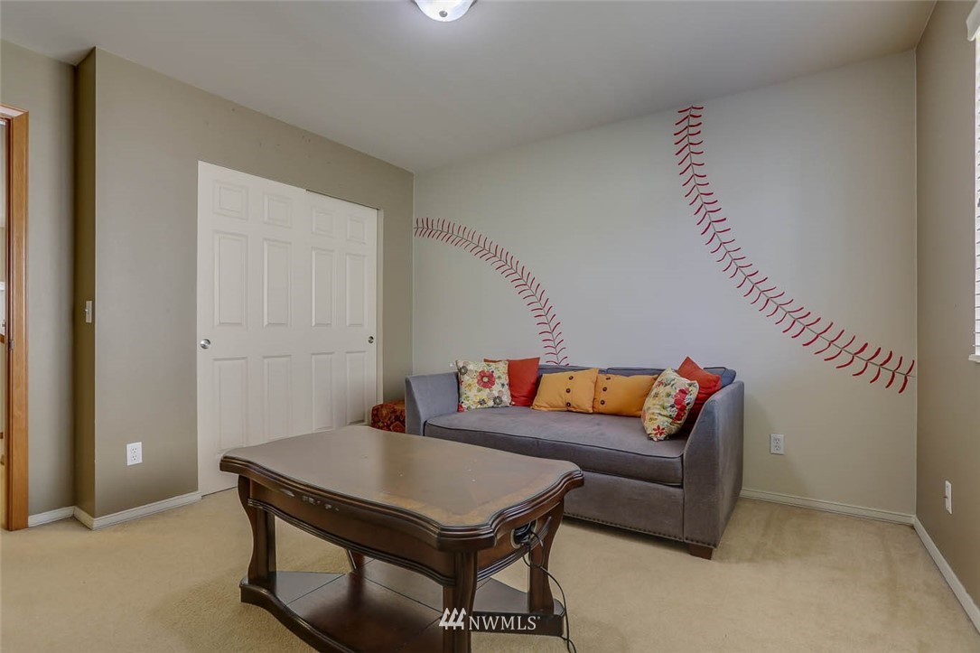 363 Pasco Drive Northeast Renton, WA 98059 - Photo 20 of 26 a living room with furniture and a wooden floor