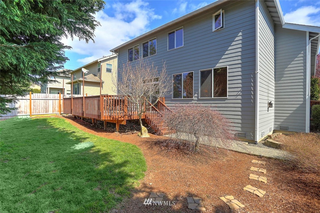 363 Pasco Drive Northeast Renton, WA 98059 - Photo 22 of 26 a view of a house with backyard and a tree