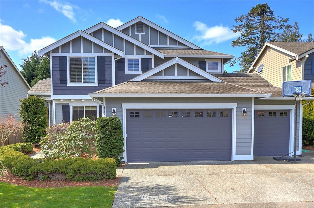 363 Pasco Drive Northeast Renton, WA 98059 - Photo 26 of 26 a front view of a house with a yard and garage