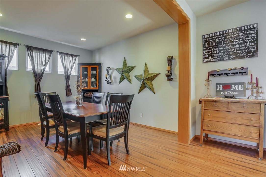 363 Pasco Drive Northeast Renton, WA 98059 - Photo 7 of 26 a dining room with furniture and wooden floor