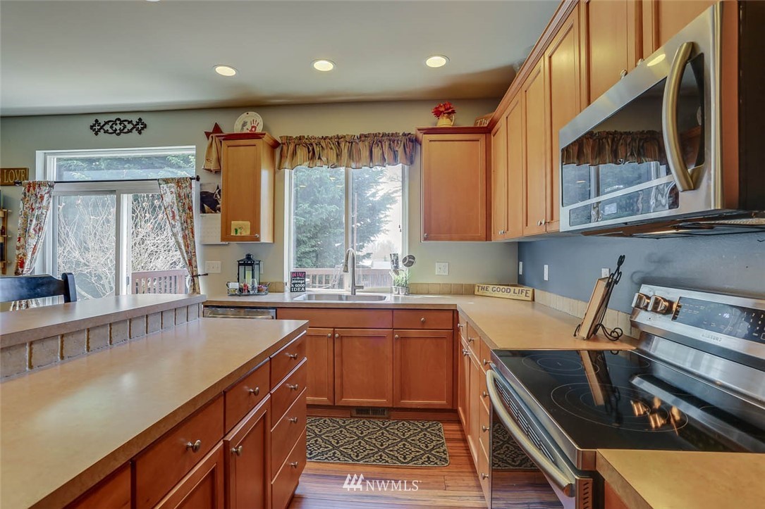 363 Pasco Drive Northeast Renton, WA 98059 - Photo 10 of 26 a kitchen with a sink appliances and cabinets