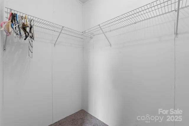 a view of an empty room and a window