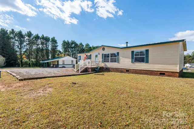 a view of balcony with wooden floor and fence