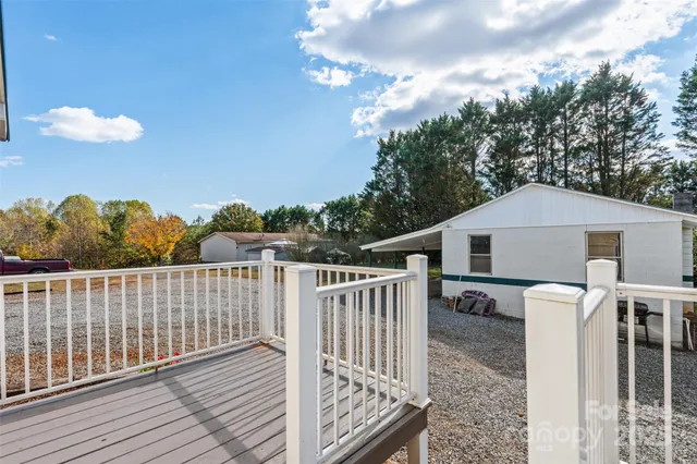 a view of an empty room with a fireplace