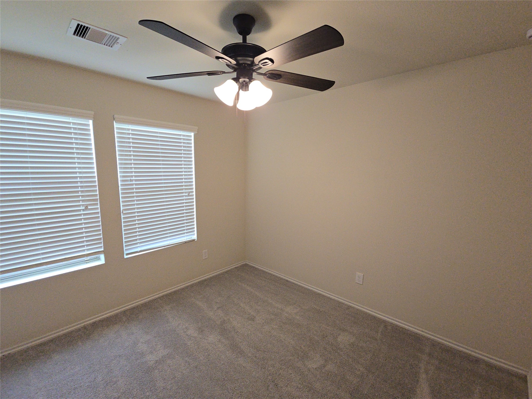810 Lightningbug Lane Conroe, TX 77301 - Photo 15 of 27 an empty room with a window and a fan