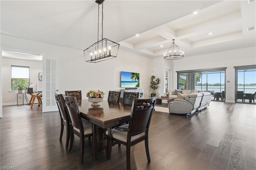 19696 Aqua View Lane Fort Myers, FL 33913 - Photo 8 of 50 a view of a dining room with furniture wooden floor and chandelier