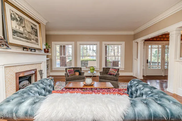 a kitchen with kitchen island a counter top space a sink stainless steel appliances and cabinets