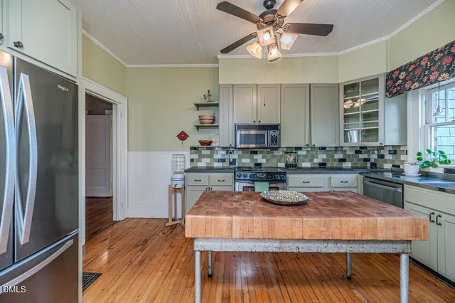 a bathroom with a sink vanity granite and a mirror