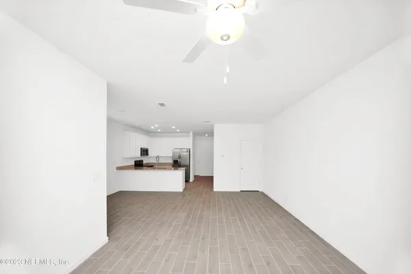 a view of a kitchen with a sink and cabinets