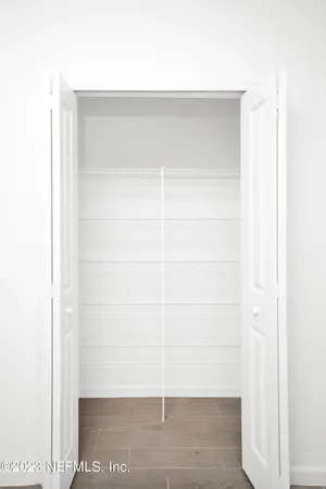 a view of staircase with white walls