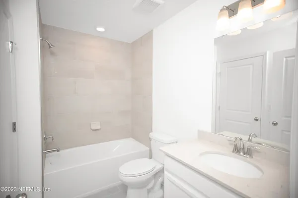 a bathroom with a sink a toilet and a bathtub