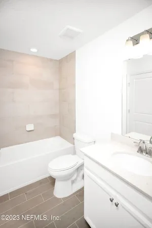 a bathroom with a bathtub and shower