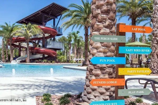 a view of a swimming pool with a patio and a porch