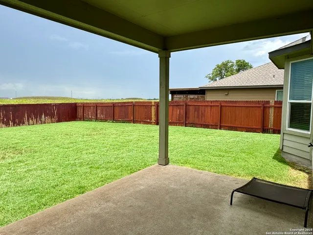 a view of back yard of the house