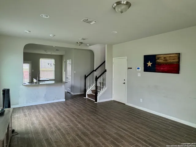 a view of an entryway with wooden floor