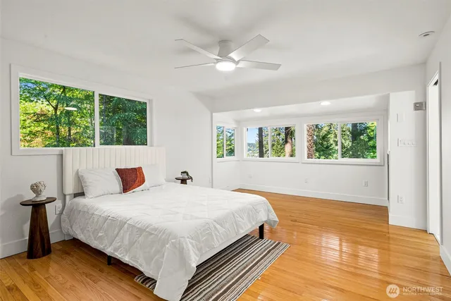 a bedroom with a large bed and a window