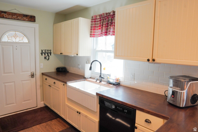 324 Stringtown Road Georgetown, ID 83239 - Photo 14 of 49 Kitchen with dishwasher, tasteful backsplash, dark wood-style floors, and wooden counters