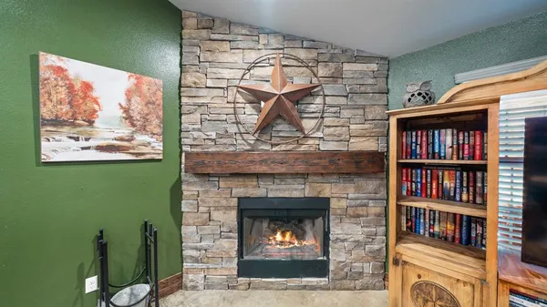 a kitchen with refrigerator and cabinets