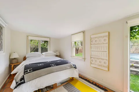 a room with a bed and a window