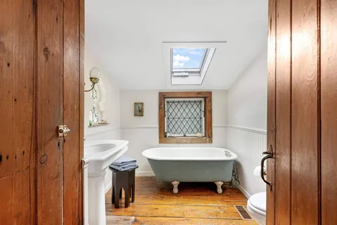 a bathroom with a bathtub sink and toilet