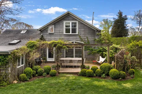 a front view of house with garden