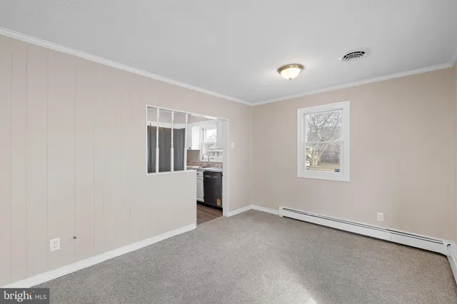 a view of an empty room with a window