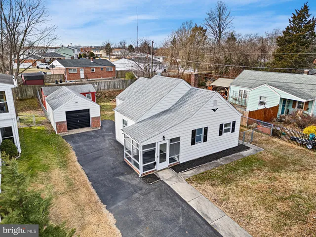 a aerial view of a house with a yard