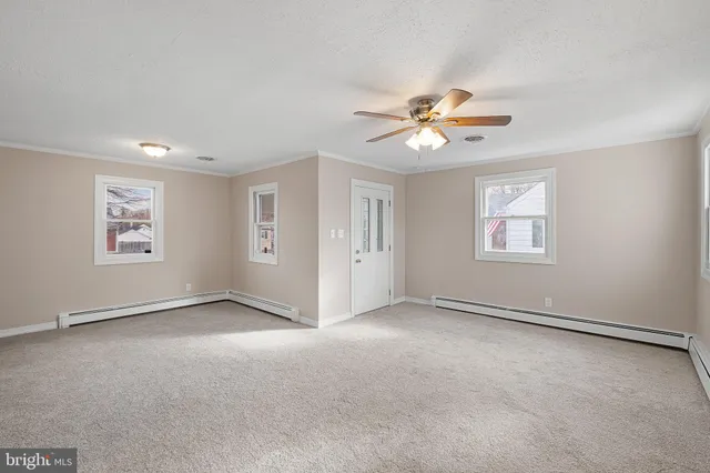 a view of an empty room with a window