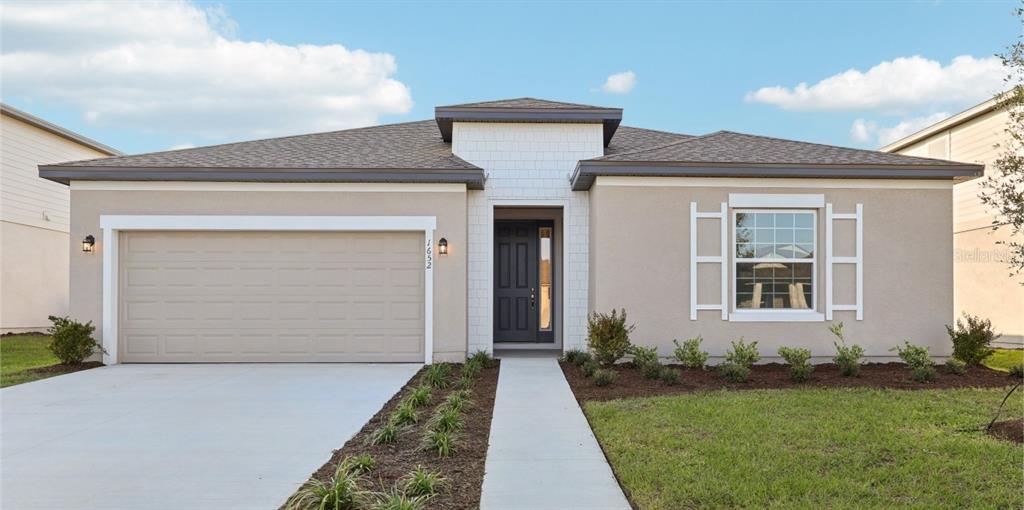 1652 Cane Bamboo Drive St. Cloud, FL 34771 - Photo 1 of 1 front view of a house with a yard