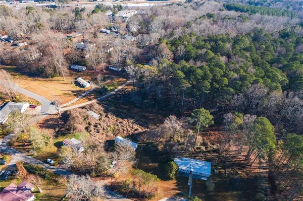 an aerial view of residential house and green space