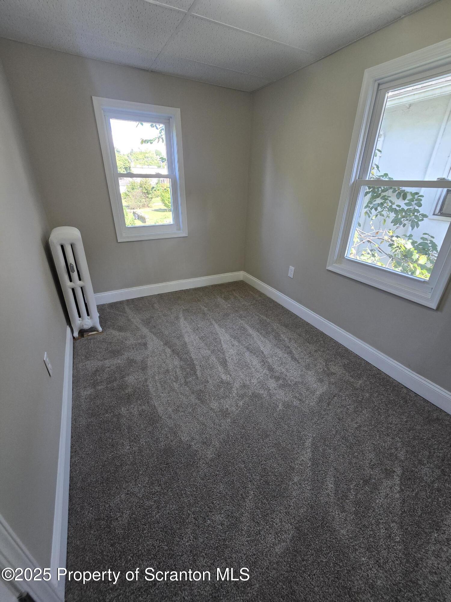 323 Larch Street Scranton, PA 18509 - Photo 18 of 18 a view of an empty room and a window