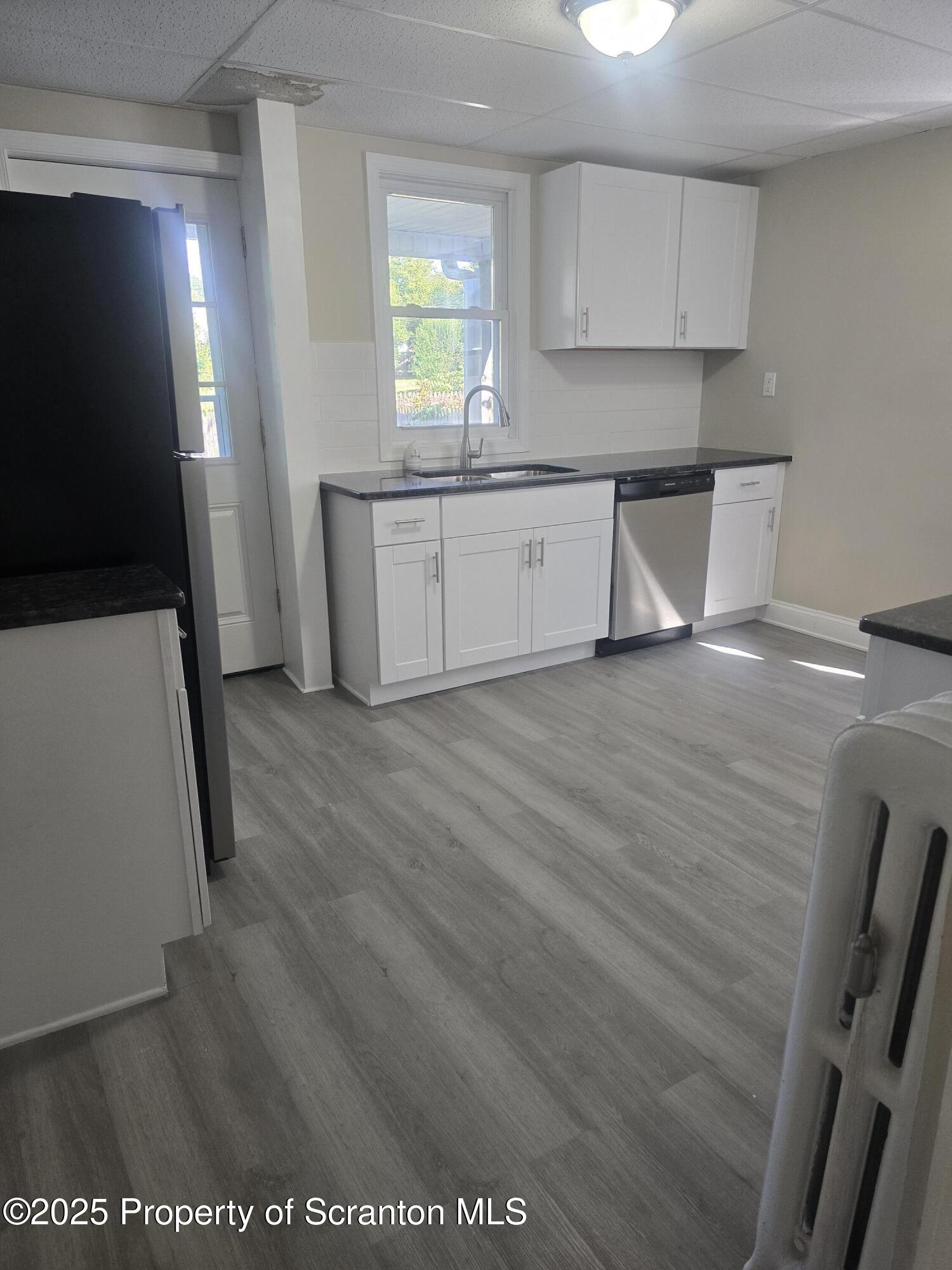 323 Larch Street Scranton, PA 18509 - Photo 2 of 18 a view of a kitchen from the hallway