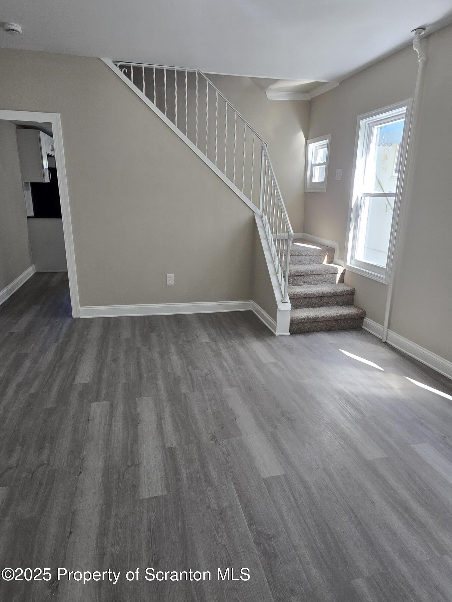 323 Larch Street Scranton, PA 18509 - Photo 8 of 18 a view of an entryway with wooden floor