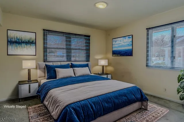 a bedroom with bed and window