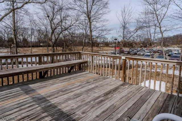 a view of wooden deck and a trees