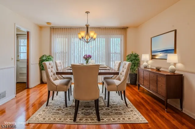 a view of a dining room with furniture window and wooden floor