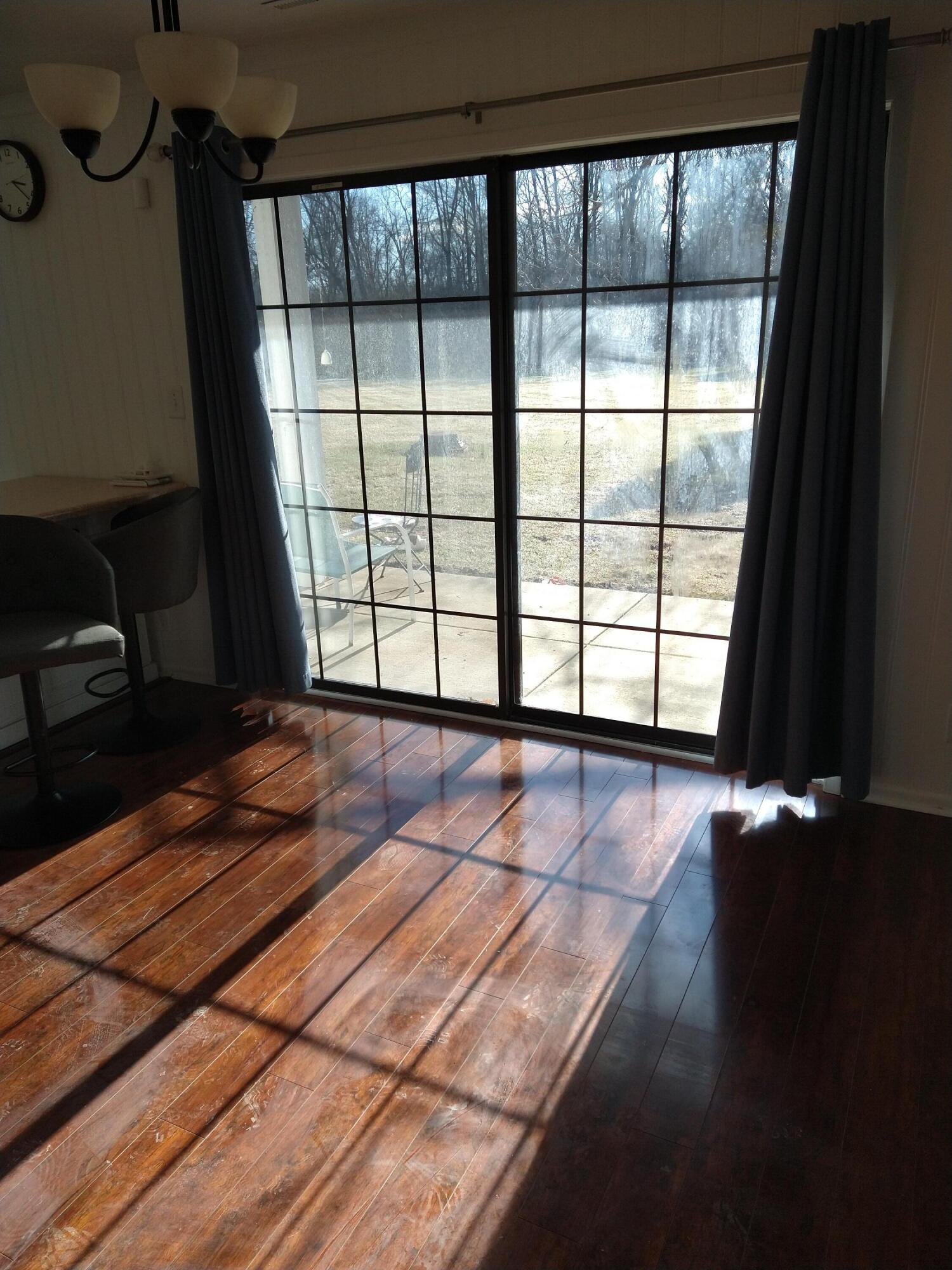 20245 Independence Drive, Unit B Brookfield, WI 53045 - Photo 3 of 23 dining room with south facing patio door
